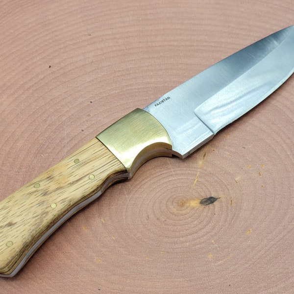 Buck knife with handmade applewood handle and brass pins and bolster. Could be used in the kitchen or as a camping/hunting knife.