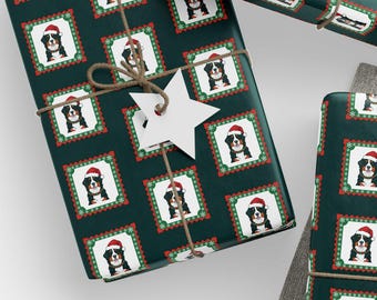 May include: Gift-wrapped presents with dark green paper featuring a repeating pattern of a dog wearing a Santa hat. The gifts are tied with twine and adorned with white tags. A ball of twine, scissors, and additional tags are also present.
