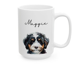 May include: White ceramic mug with a black and white illustration of a dog with the name "Maggie" written in black cursive.