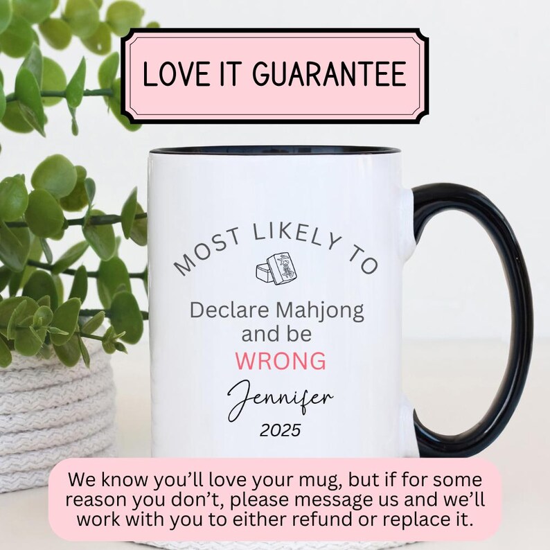 May include: White ceramic mug with a black handle and rim. The mug features the text "MOST LIKELY TO Declare Mahjong and be WRONG Jennifer 2025". A pink banner at the top reads "LOVE IT GUARANTEE".