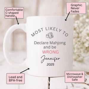 May include: White ceramic mug with a comfortable C-shaped handle. The mug features the text "MOST LIKELY TO Declare Mahjong and be WRONG Jennifer 2025". The mug is lead and BPA-free, and microwave and dishwasher safe.