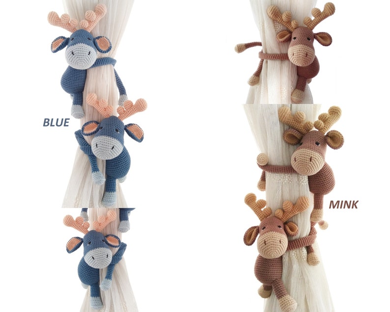 May include: Two crocheted reindeer curtain tiebacks in blue and brown. The blue reindeer is labelled "BLUE" and the brown reindeer is labelled "MINK".