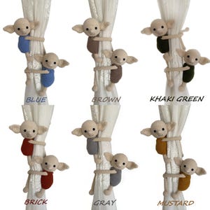 May include: Six crocheted elf dolls in different colours, each holding onto a white curtain. The colours are blue, brown, khaki green, brick, grey, and mustard.