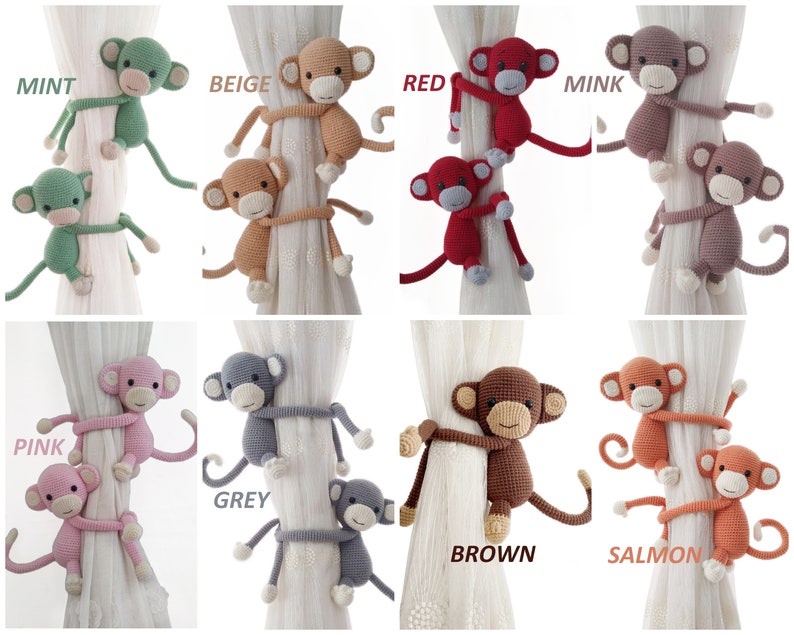 May include: Set of 10 crocheted monkey curtain tiebacks in various colours, including mint, beige, red, mink, pink, grey, brown, and salmon. Each tieback features two monkeys holding onto a curtain.