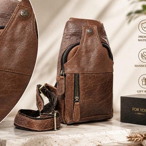 May include: A brown leather sling bag with a textured finish, featuring a vertical zippered front pocket, a main compartment with a top flap, a metal snap button, and an adjustable strap. A black box with the gold text FOR YOU is visible nearby.