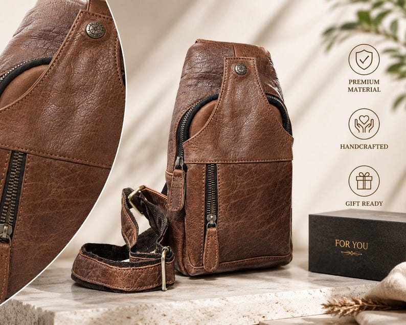 May include: A brown leather sling bag with a textured finish, featuring a vertical zippered front pocket, a main compartment with a top flap, a metal snap button, and an adjustable strap. A black box with the gold text FOR YOU is visible nearby.