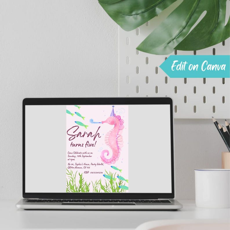 May include: A laptop displays a birthday invitation with a pink seahorse illustration. The invitation reads "Sarah turns five!" with details about the party. Green fish and aquatic plants decorate the design. The words "Edit on Canva" are visible.
