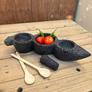 Pea-shaped sauce boat made of volcanic stone