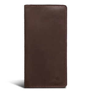 May include: A dark brown leather wallet with a rectangular shape. The wallet has a stitched border and a small logo in the lower right corner. The leather appears to be smooth and the overall design is simple and elegant.