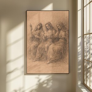 May include: A framed sepia artwork shows three robed figures seated, working together. The figures, with draped head coverings, are drawn in a classical style. The artwork is displayed in a black frame, adding a touch of elegance to the piece.