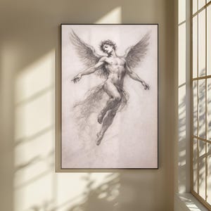 May include: A framed charcoal drawing of a winged figure in mid-flight. The artwork depicts a nude male figure with outstretched arms and large feathered wings. The drawing is in shades of gray and black.