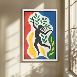 Könnte beinhalten: Ein gerahmter Kunstdruck mit der schwarzen Silhouette einer tanzenden Figur inmitten abstrakter Formen in Rot, Blau, Gelb und Grün. Die Komposition enthält stilisierte grüne Blattmotive auf cremefarbenem Hintergrund, eingefasst in einen dünnen schwarzen Rahmen.