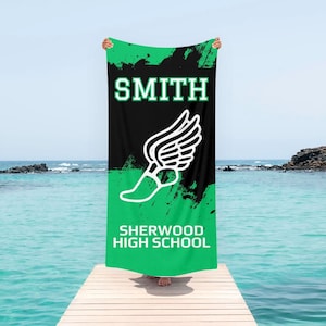 May include: Green and black beach towel with a white running shoe graphic and the text "SMITH SHERWOOD HIGH SCHOOL".