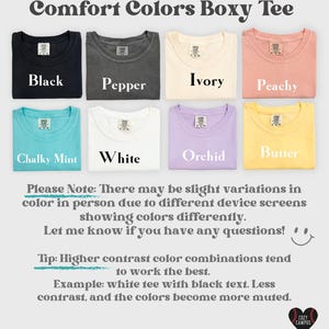 May include: A collection of eight boxy t-shirts in black, pepper, ivory, peachy, chalky mint, white, orchid, and butter colors. Each shirt features a crew neckline and a brand label at the inner collar. The text Comfort Colors Boxy Tee is displayed at the top, with additional notes regarding color variations and contrast tips included below the shirts.