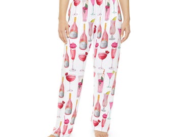 May include: White pajama pants with a pink and white pattern of cocktails and champagne bottles.