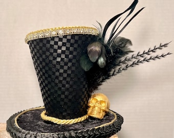 Small black and gold skeleton top Hat. embellished with rhinestone and gold trim. Perfect for a pumpkin, skeleton wreath or Halloween