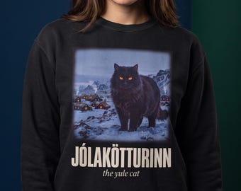 Icelandic Christmas Sweatshirt, Jolakotturinn Giant Yule Cat Over Village Crewneck, Nordic Folklore Black Cat, Goth Christmas Gift