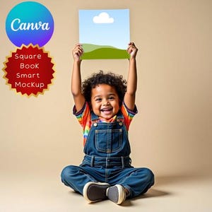 May include: A young child in denim overalls and a rainbow striped shirt holds up a square book mockup with a blue sky and green hills design. The Canva and Square Book Smart Mockup logos are visible.