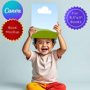 May include: A child smiles while holding a book mockup. The book shows a blue sky, white cloud, and green hills. The image includes text that says "Canva" and "Book Mockup". A purple badge states "For 8.5"x11" Books". The book size is approximately 21.6cm x 28cm.