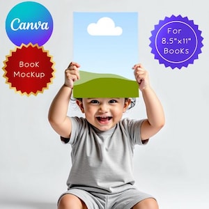 May include: A smiling child holds a book mockup with a blue sky and green landscape design. The image includes text that says "Canva" and "Book Mockup". The book is designed for 8.5"x11" books.