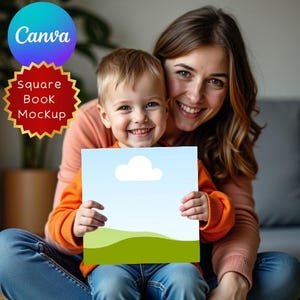 May include: A child and adult smile while holding a square book mockup with a blue sky and cloud design. The child wears an orange long-sleeve top and blue jeans. The adult wears an orange long-sleeve top and blue jeans. The Canva logo is in the upper left.