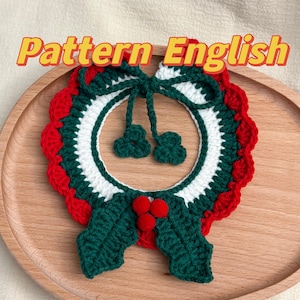 May include: A crocheted Christmas wreath with red and white trim, green holly leaves, and red berries. The wreath has a bow made of the same yarn.
