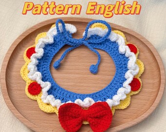 May include: A handmade crochet pet collar in blue, white, yellow, and red. The collar features a blue base with white trim, yellow scalloped edges, and a red bow. The text "Pattern English" is displayed.