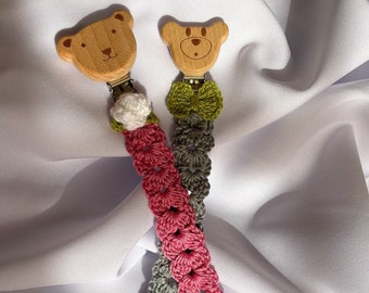 Crocheted pacifier holder.