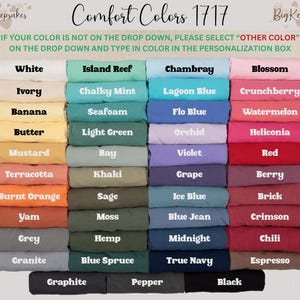 May include: A color chart displays a variety of Comfort Colors 1717 t-shirt hues. The image showcases a spectrum of shades, including white, blue, pink, yellow, and green. Text at the top reads "Comfort Colors 1717" and provides instructions for color selection.