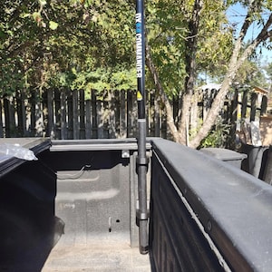 May include: A black and blue antenna pole with the text "DX COMMANDER" is mounted in a truck bed. The pole is secured with black mounting brackets. The image includes the text "Please read description MOUNTS ONLY".