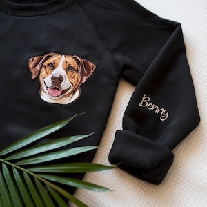 May include: Black sweatshirt with an embroidered dog portrait on the front and the name "Benny" embroidered on the sleeve.