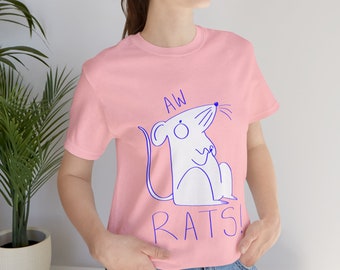 May include: A pink t-shirt with a blue illustration of a rat and the text "AW RATS!"
