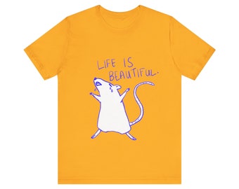 May include: A yellow t-shirt with a white rat illustration and the text "Life is beautiful."