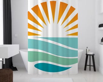 May include: A white shower curtain featuring a graphic of a stylised orange sun setting over a turquoise and green ocean.