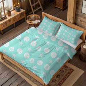 May include: A turquoise duvet cover and two pillowcases featuring a white sand dollar and starfish design. The bedding is on a wooden bed frame, creating a coastal theme. The room has a rustic, beachy vibe.