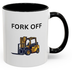 May include: White ceramic mug with a black rim and handle. The mug has the text "FORK OFF" printed in black on the front. Below the text is a cartoon image of a yellow forklift.