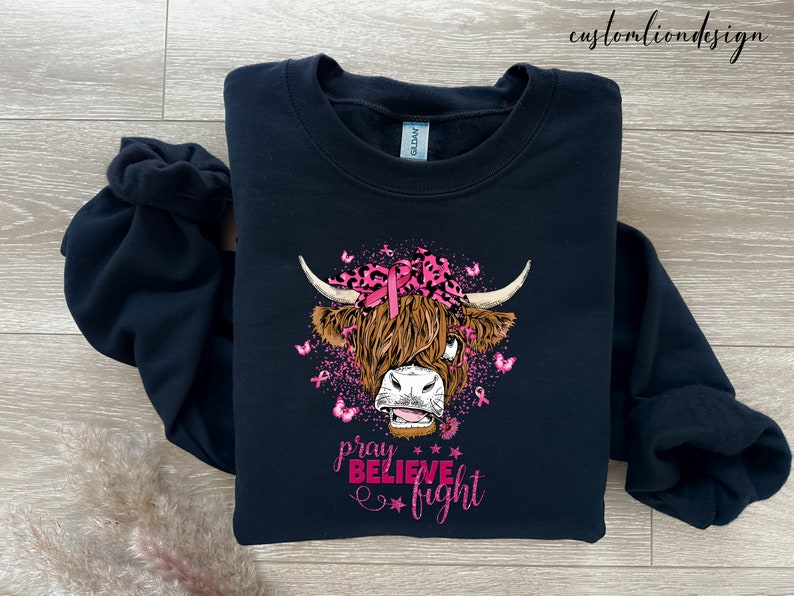 a black shirt with a cow's head on it