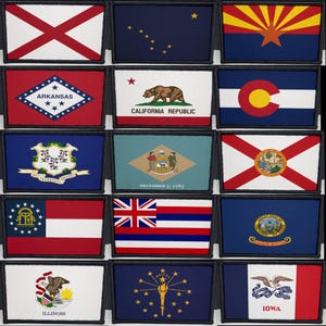 May include: A selection of embroidered patches displaying the flags of different U.S. states. Each patch is rectangular with a black border, showcasing the distinctive designs and colours of each state's flag. The flags include Alabama, Alaska, Arizona, Arkansas, California, Colorado, Connecticut, Delaware, Florida, Georgia, Hawaii, Idaho, Illinois, Indiana, and Iowa.