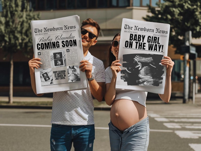 May include: A couple holding up two newspaper-style announcements. The first announcement reads "The Newborn News" with the headline "Baby Claudia Coming Soon". The second announcement reads "The Newborn News" with the headline "Baby Girl On The Way!"