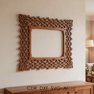 May include: A decorative wooden picture frame with an intricate, openwork design. The frame is a warm brown color and is mounted on a neutral-colored wall. The text "CDR DXF SVG AI" is visible at the bottom.