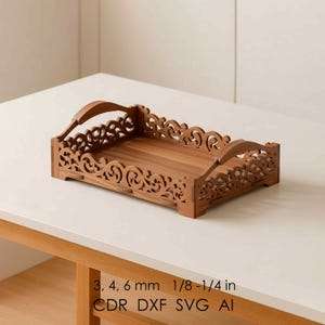 May include: A wooden tray with intricate, carved scrollwork along the sides and a handle. The tray is a warm brown color and sits on a white surface. The text on the image reads: 3, 4, 6 mm 1/8-1/4 in CDR DXF SVG AI.