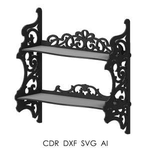 Könnte beinhalten: Schwarzes, zweistufiges Wandregal mit aufwendigen Schnörkeldetails. Die Regale sind grau, und das Design umfasst dekorative Verzierungen an der Oberseite und den Seiten. Der Text "CDR DXF SVG AI" befindet sich unten.