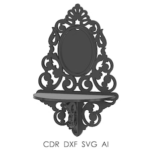 May include: A dark gray, ornate wall shelf with an oval mirror and a small shelf below. The design features intricate scrollwork and the text "CDR DXF SVG AI" at the bottom. This decorative shelf is suitable for displaying small items.