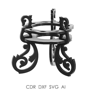 May include: Black decorative stand with an ornate, scrollwork design. The stand has a circular top with multiple openings and is supported by three curved legs. The text "CDR DXF SVG AI" is at the bottom of the image.
