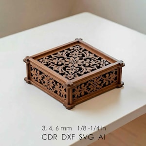 May include: A square wooden box with detailed floral patterns carved into the lid and sides. The box is a warm brown colour. The text on the image reads: 3, 4, 6 mm 3.2-6.4 mm CDR DXF SVG AI.