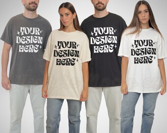May include: Four people are wearing oversized t-shirts with the text "YOUR DESIGN HERE" printed in black on different colored shirts. The shirts are grey, beige, black, and white.