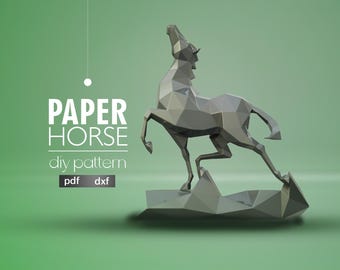 May include: A gray papercraft horse model, standing on its hind legs with its head tilted back. The horse is made of many small triangles, giving it a geometric look. The text "PAPER HORSE diy pattern pdf dxf" is printed below the horse.