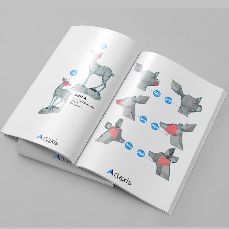 May include: A booklet with instructions for building a 3D paper model of a deer. The booklet shows the individual pieces and how to assemble them. The booklet is titled "Part A" and has the text "Art axis" on the cover.