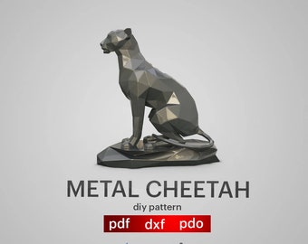 May include: A black metal cheetah sculpture in a sitting pose. The sculpture is made of geometric shapes and has a shiny finish. The sculpture is sitting on a rock base. The image includes the text "METAL CHEETAH diy pattern pdf dxf pdo Artaxis artaxis studio".