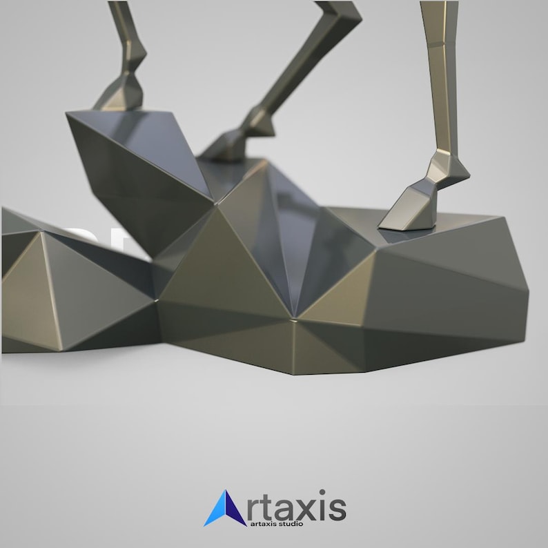 May include: A geometric, metallic sculpture with a faceted design. The sculpture features angular shapes and a reflective surface, with a light source creating highlights and shadows. The base is a series of interconnected geometric forms.